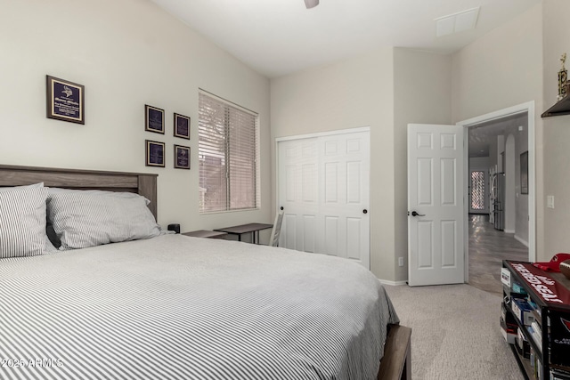 carpeted bedroom with a closet