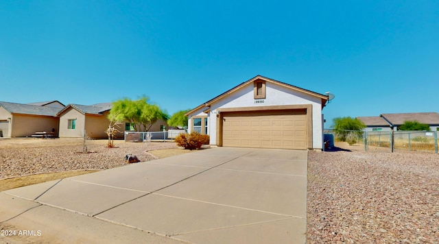 ranch-style home featuring a garage