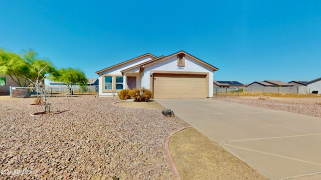 ranch-style house featuring a garage