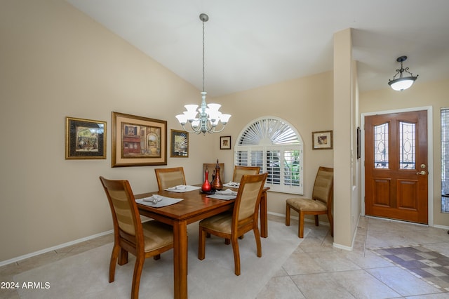 dining area featuring high vaulted ceiling, a chandelier, and light tile patterned flooring