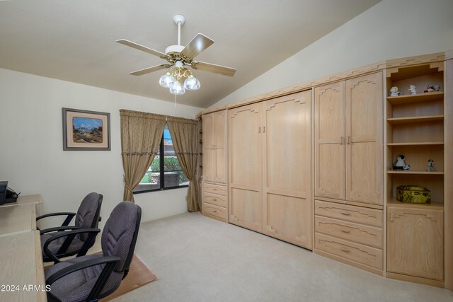 office with ceiling fan, light carpet, and vaulted ceiling