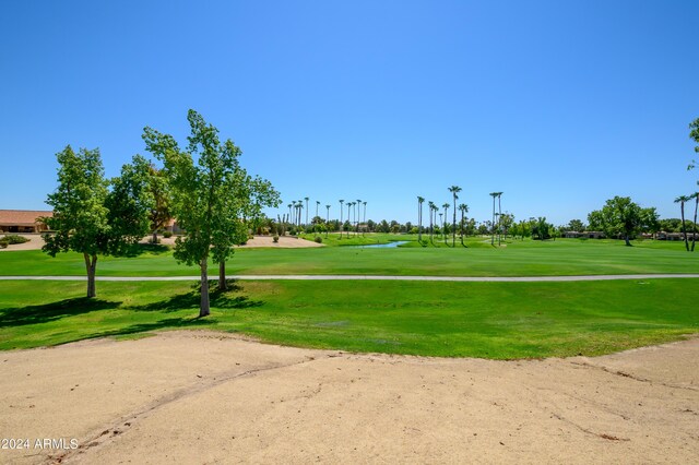 surrounding community featuring a lawn