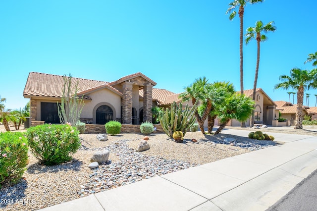 mediterranean / spanish house featuring a garage