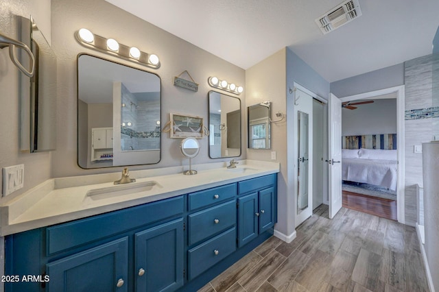 bathroom with vanity and hardwood / wood-style flooring