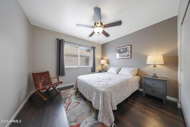 bedroom featuring dark hardwood / wood-style floors and ceiling fan