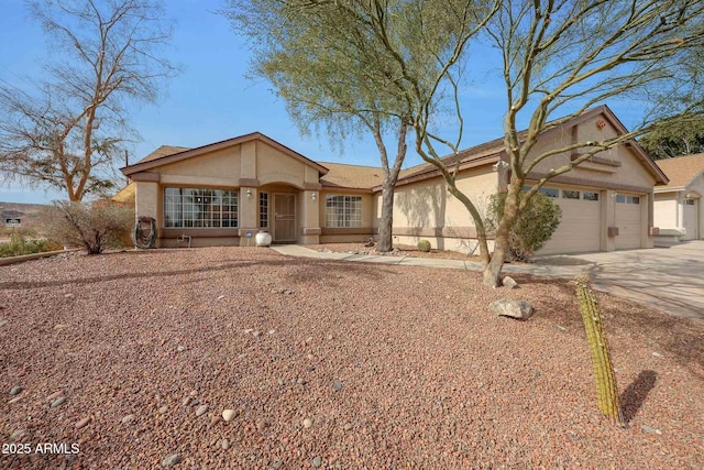 ranch-style home featuring a garage