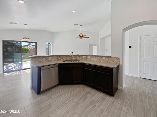 kitchen with lofted ceiling, sink, dark brown cabinetry, stainless steel dishwasher, and light stone counters