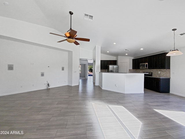 unfurnished living room with high vaulted ceiling and ceiling fan