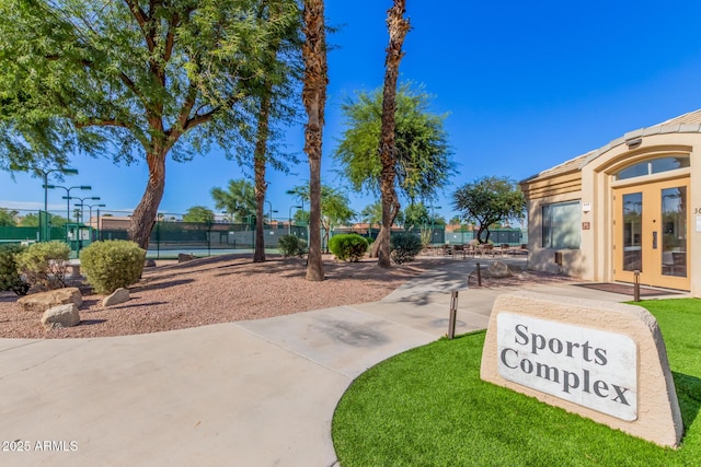 view of home's community with fence