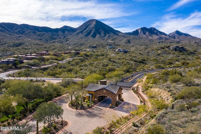 birds eye view of property with a mountain view