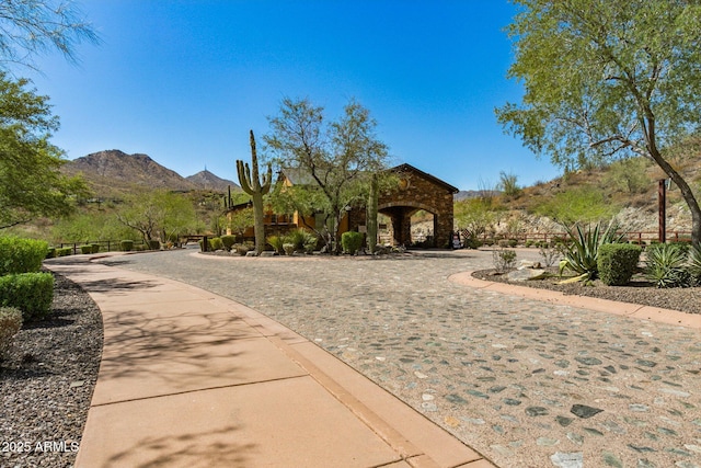 view of front of property featuring a mountain view and stone siding