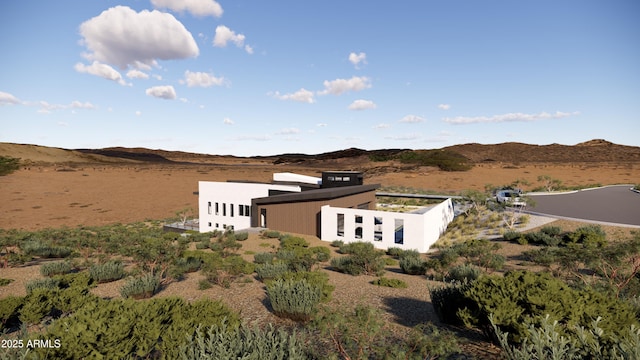 birds eye view of property with a mountain view