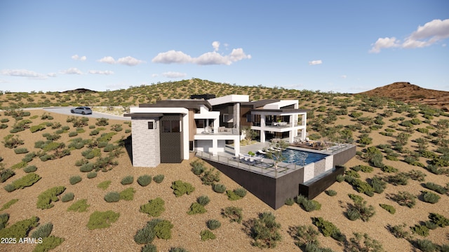 exterior space with a mountain view and a balcony