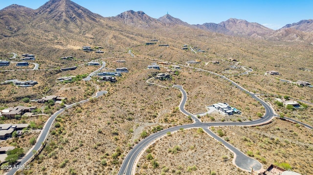 birds eye view of property with a mountain view