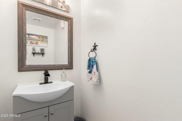 bathroom featuring visible vents and vanity