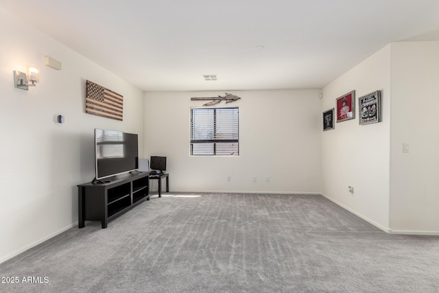 carpeted living room featuring visible vents and baseboards