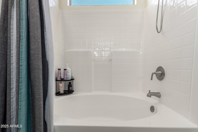 bathroom with a wealth of natural light and shower / bath combo with shower curtain