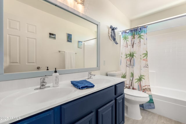 bathroom featuring double vanity, shower / tub combo, a sink, and toilet