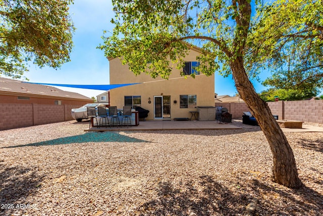 back of property featuring a patio area, a fenced backyard, and stucco siding