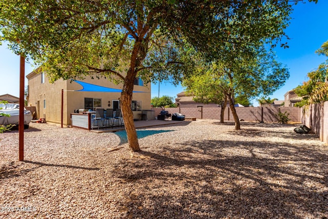 view of yard with a patio area and a fenced backyard