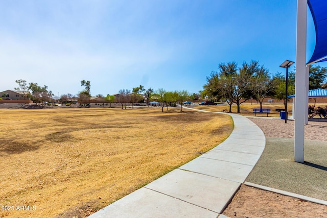 view of property's community featuring a lawn