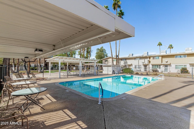 view of swimming pool with a pergola and a patio