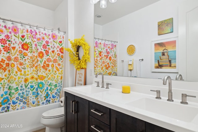 full bathroom featuring vanity, toilet, and shower / bath combo with shower curtain