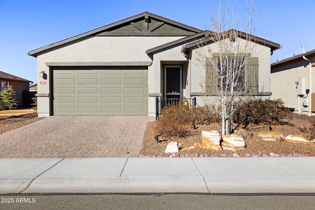 single story home with a garage