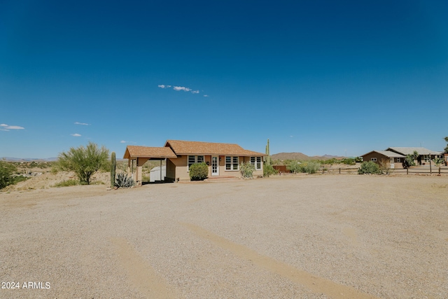 ranch-style home featuring a mountain view