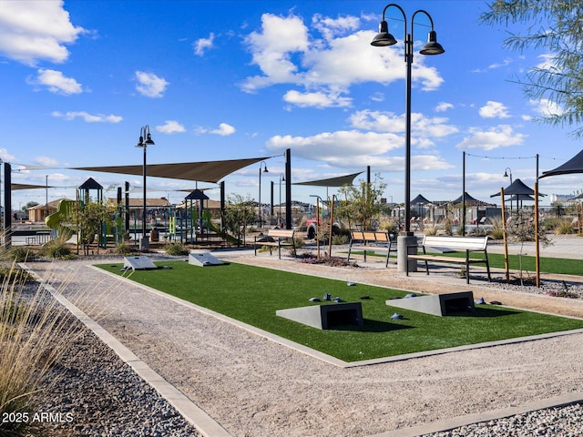 view of home's community featuring a yard and a playground