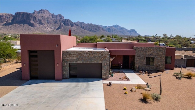 southwest-style home with a mountain view and a garage