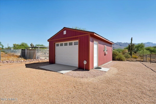 garage with a mountain view and wood walls