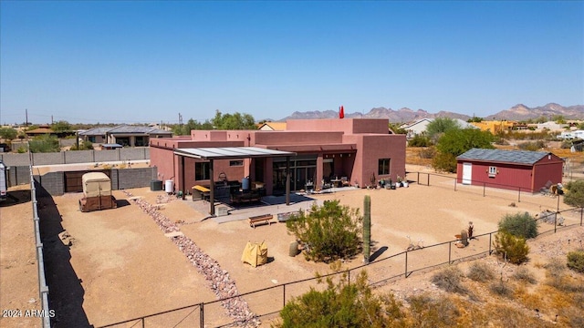 rear view of property with a mountain view