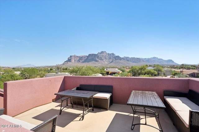 balcony featuring outdoor lounge area and a mountain view