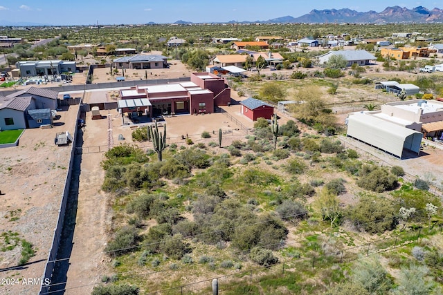 birds eye view of property featuring a mountain view