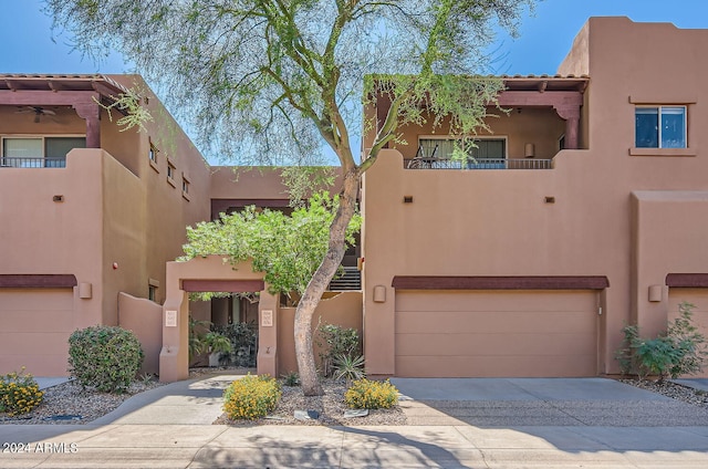 southwest-style home with a garage