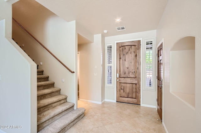 foyer with light tile patterned floors