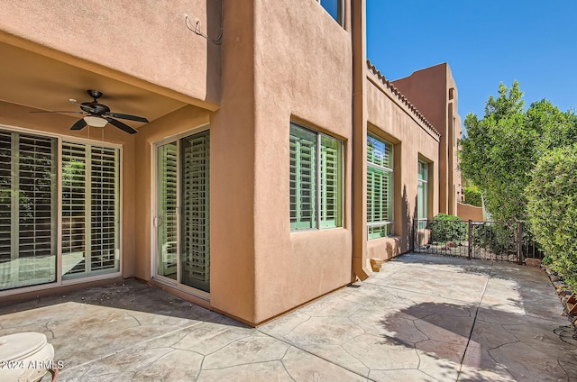 view of patio featuring ceiling fan