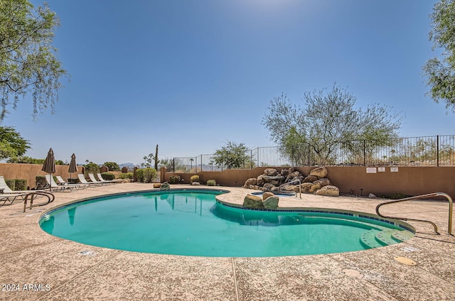 view of swimming pool featuring a patio area