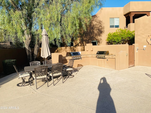 view of patio / terrace featuring area for grilling and an outdoor kitchen