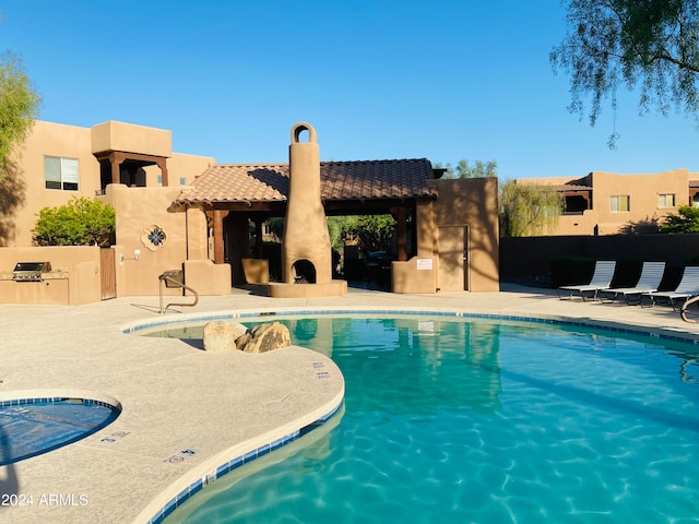 view of pool featuring a patio area