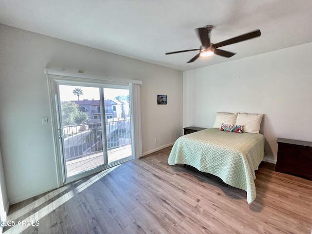 bedroom with wood finished floors, a ceiling fan, baseboards, and access to outside