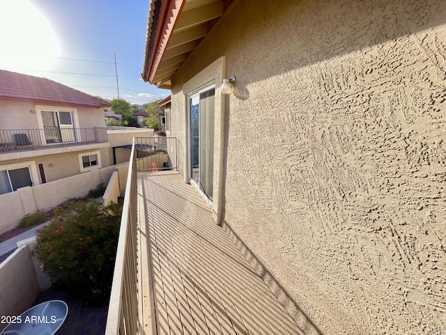 view of home's exterior featuring stucco siding and a balcony