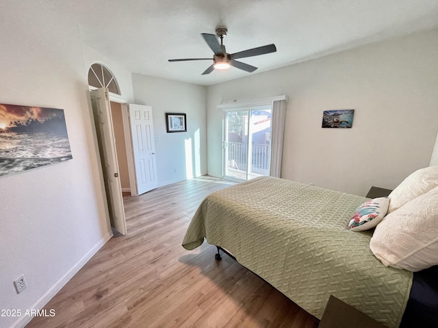 bedroom featuring baseboards, access to exterior, a ceiling fan, and light wood finished floors