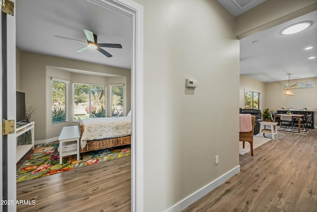 hall with hardwood / wood-style floors