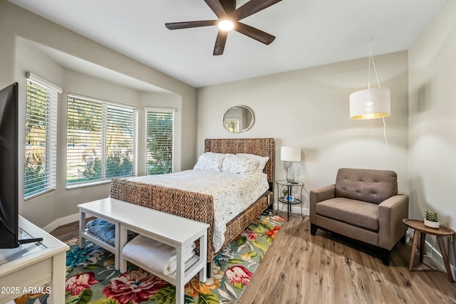 bedroom featuring ceiling fan and light hardwood / wood-style flooring