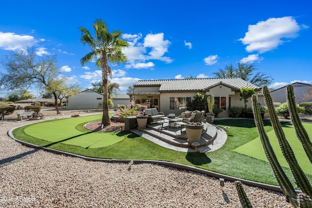 back of house with an outdoor hangout area and a patio