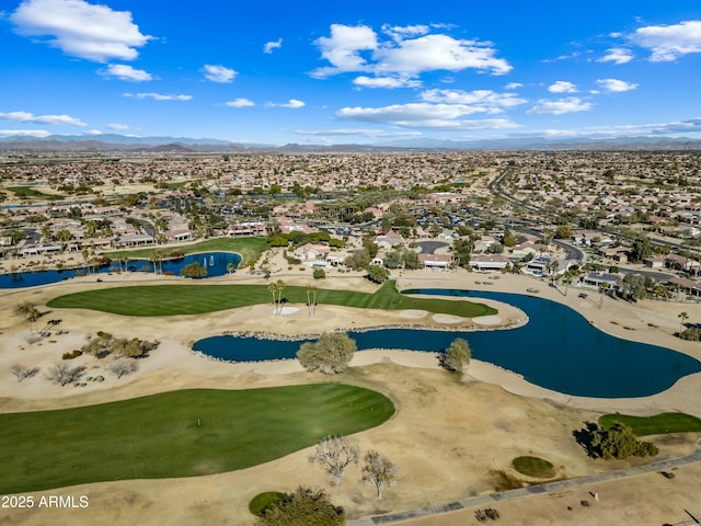 drone / aerial view with a water and mountain view