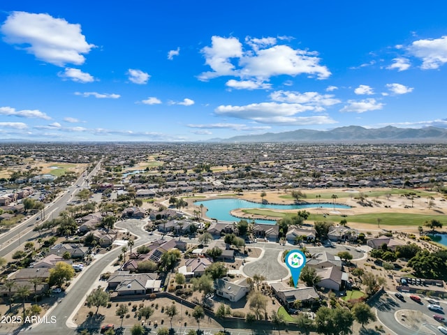 birds eye view of property with a mountain view