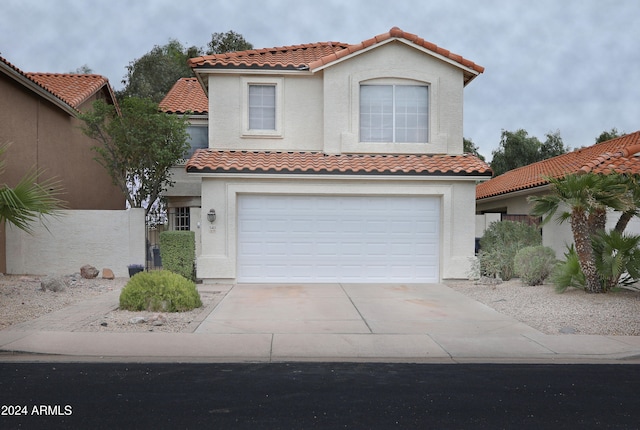 mediterranean / spanish-style house featuring a garage